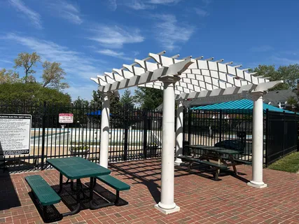 a view of a park with iron fence