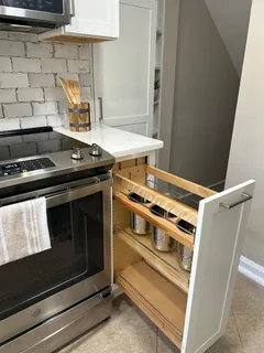 a stove top oven sitting inside of a kitchen