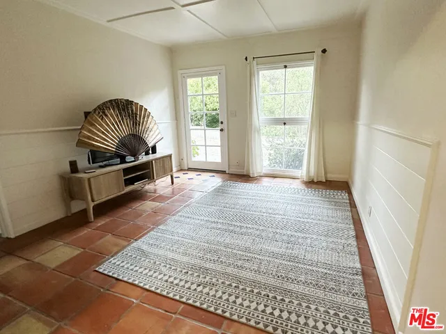 a room with furniture and a rug