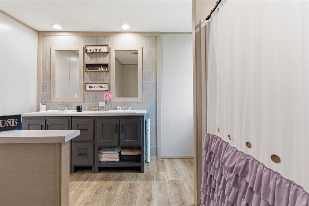 8792 Highway 67 Saltillo, TX 75478 - Photo 26 of 40 a bathroom with a sink and a mirror