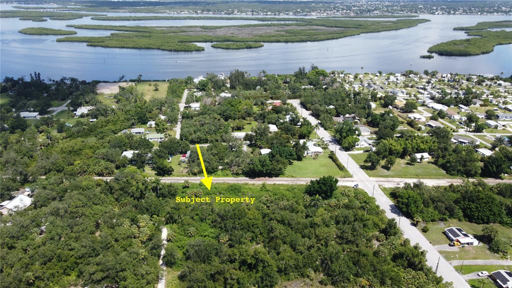 27520 Mitchell Avenue Punta Gorda, FL 33982 - Photo 2 of 3 a view of a lake with a park