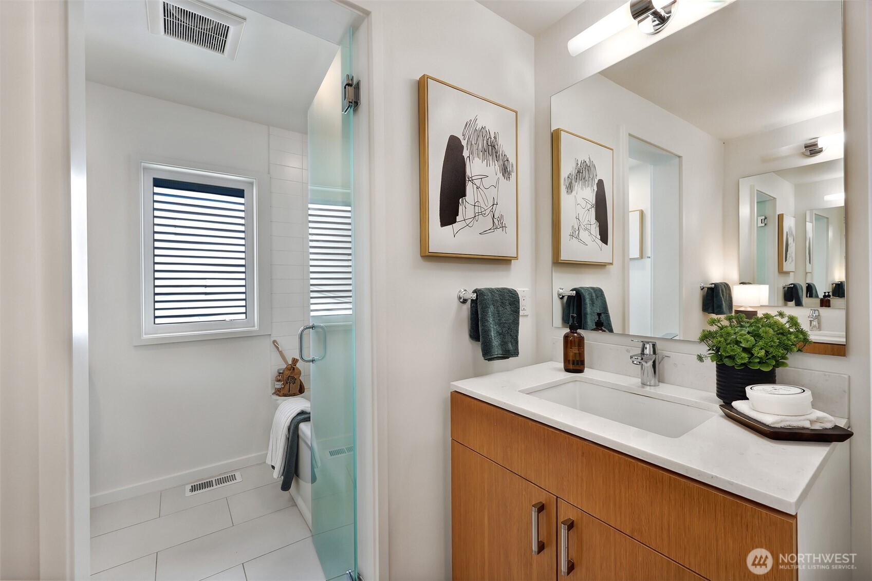 2547 Northeast 83rd Street Seattle, WA 98115 - Photo 22 of 38 a bathroom with a sink and a mirror