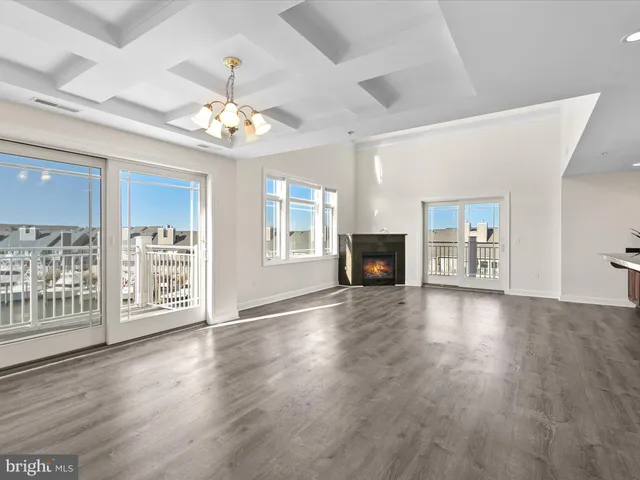 a kitchen with granite countertop a refrigerator and stove