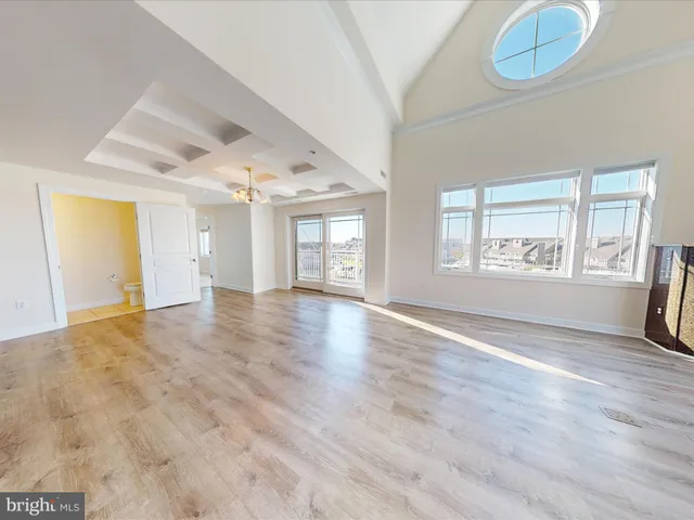 a kitchen with stainless steel appliances granite countertop a sink stove and microwave