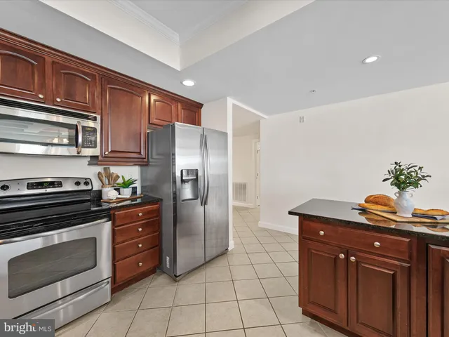 a bathroom with a double vanity sink mirror and toilet