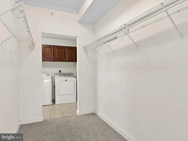 an empty room with a ceiling fan and window
