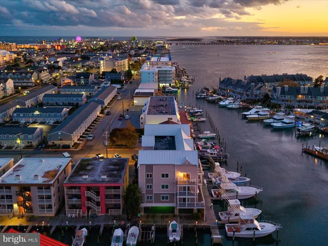an aerial view of a house with a lake view