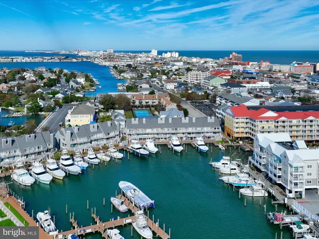 a view of a city with an ocean house swimming pool and ocean view