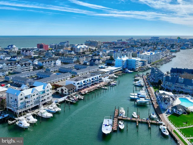 a view of a house with outdoor space and a lake view
