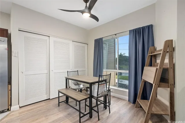 a view of a room with furniture window and wooden floor
