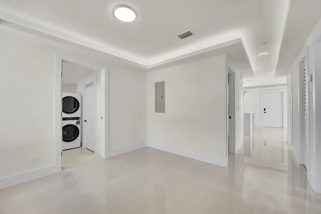 a view of a house with a big yard plants and large trees