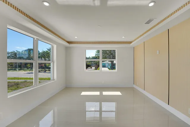 a view of empty room with floor to ceiling window