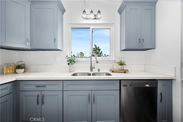 a kitchen with a sink and cabinets