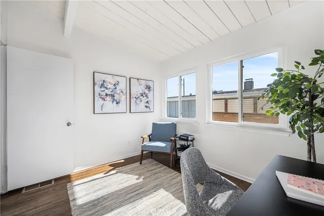 a bedroom with furniture and a window