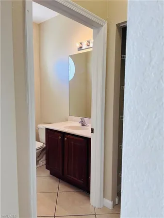a bathroom with a sink and mirror