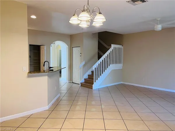 a view of entryway and kitchen