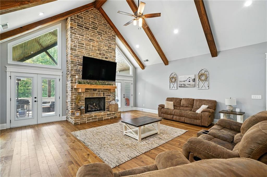 14430 Fincher Road Ball Ground, GA 30107 - Photo 17 of 51 a living room with furniture a flat screen tv and a fireplace