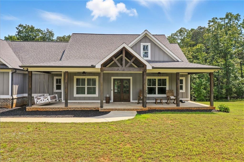 14430 Fincher Road Ball Ground, GA 30107 - Photo 2 of 51 a front view of house with a garden and swimming pool