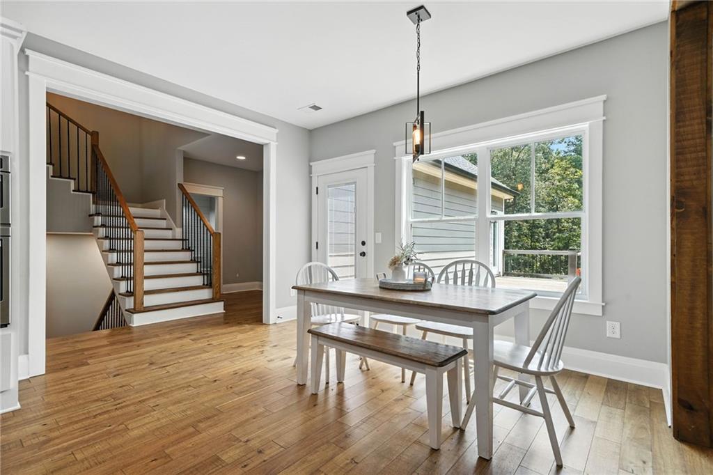 14430 Fincher Road Ball Ground, GA 30107 - Photo 25 of 51 a dining room with furniture entryway and wooden floor