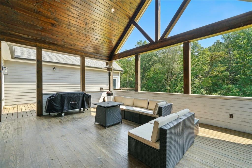 14430 Fincher Road Ball Ground, GA 30107 - Photo 27 of 51 a living room with furniture and a floor to ceiling window