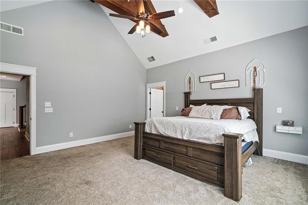 14430 Fincher Road Ball Ground, GA 30107 - Photo 37 of 51 a bedroom with a bed and cabinets