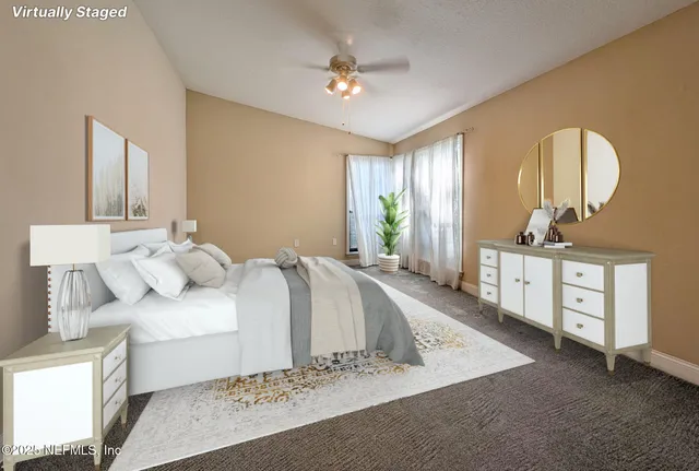 a spacious bedroom with a bed and a dresser
