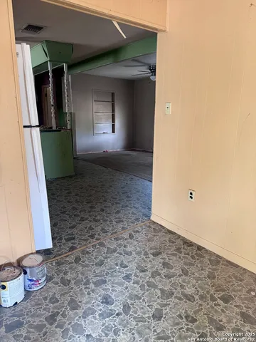 a view of entryway and kitchen