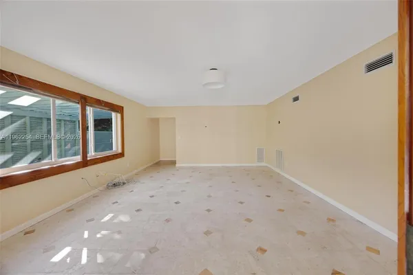 a view of empty room with a window