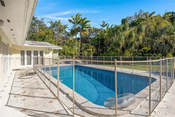 a view of a house with a swimming pool