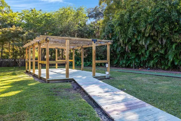 a view of a house with backyard porch and sitting area