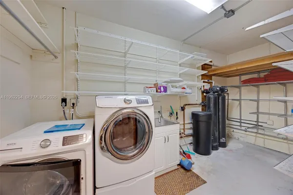 a utility room with dryer and washer