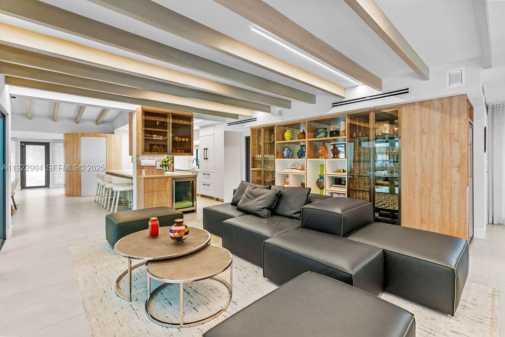 4095 Battersea Road Miami, FL 33133 - Photo 15 of 82 a living room with furniture and a large window