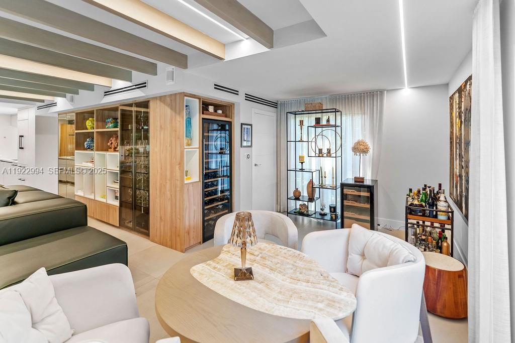 4095 Battersea Road Miami, FL 33133 - Photo 17 of 82 a living room with furniture and a table