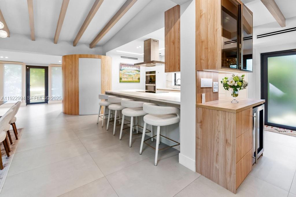 4095 Battersea Road Miami, FL 33133 - Photo 18 of 82 a dining room with furniture and a entryway