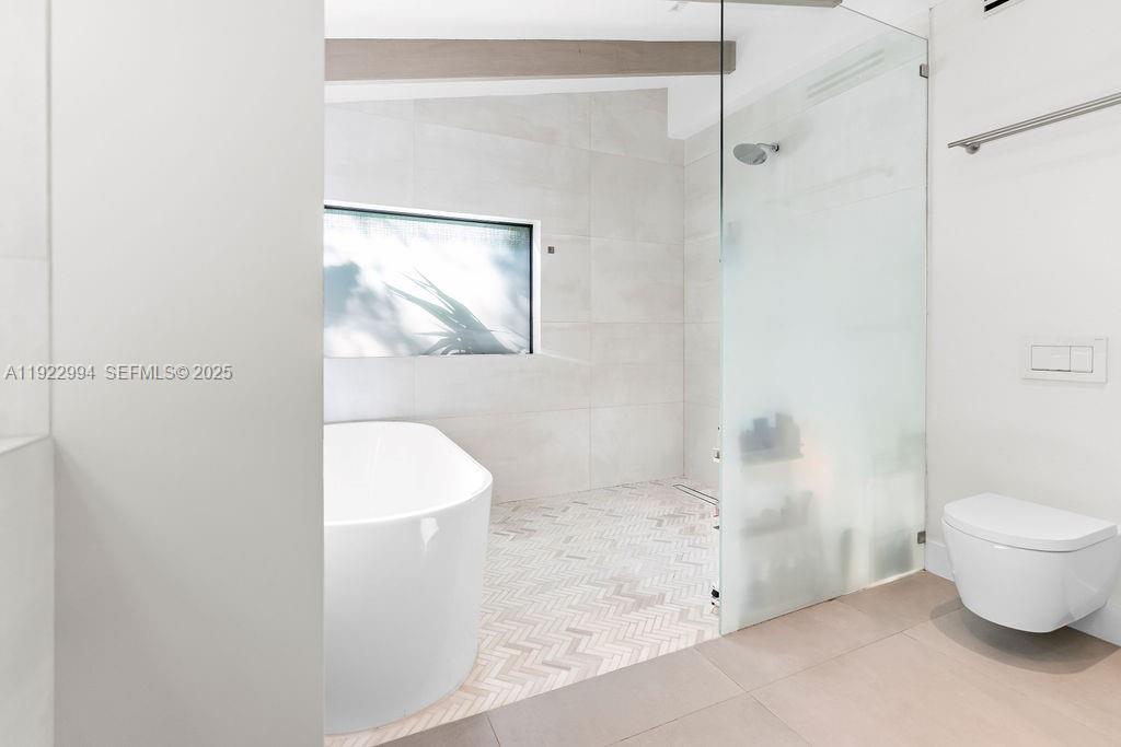 4095 Battersea Road Miami, FL 33133 - Photo 25 of 82 a bathroom with a toilet and a shower