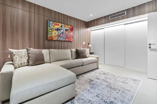a view of a patio with table and chairs with wooden floor and fence