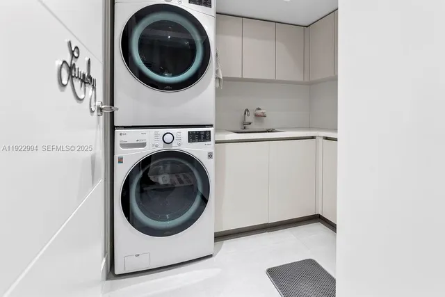 a living room with patio furniture and a large window