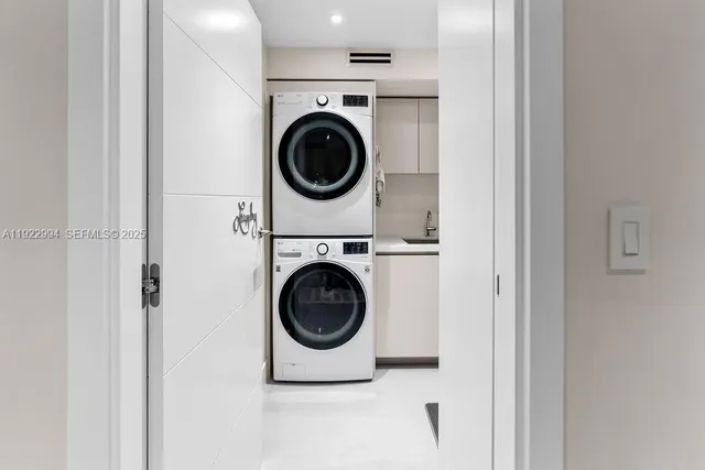 a view of a patio with table and chairs potted plants with large tree