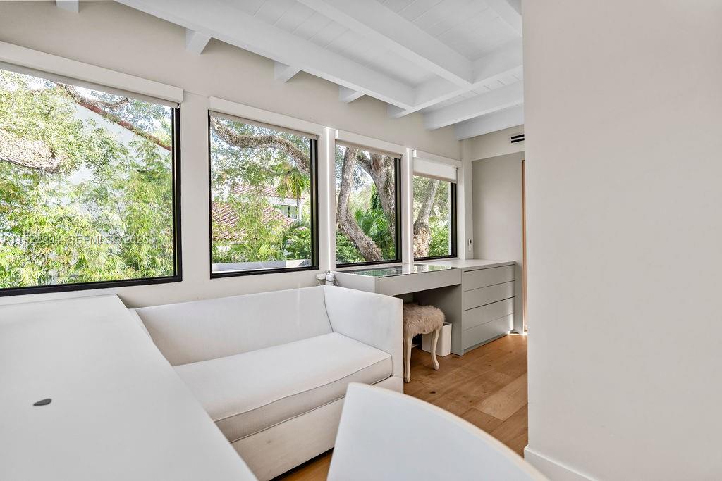 4095 Battersea Road Miami, FL 33133 - Photo 78 of 82 a living room with furniture and a large window