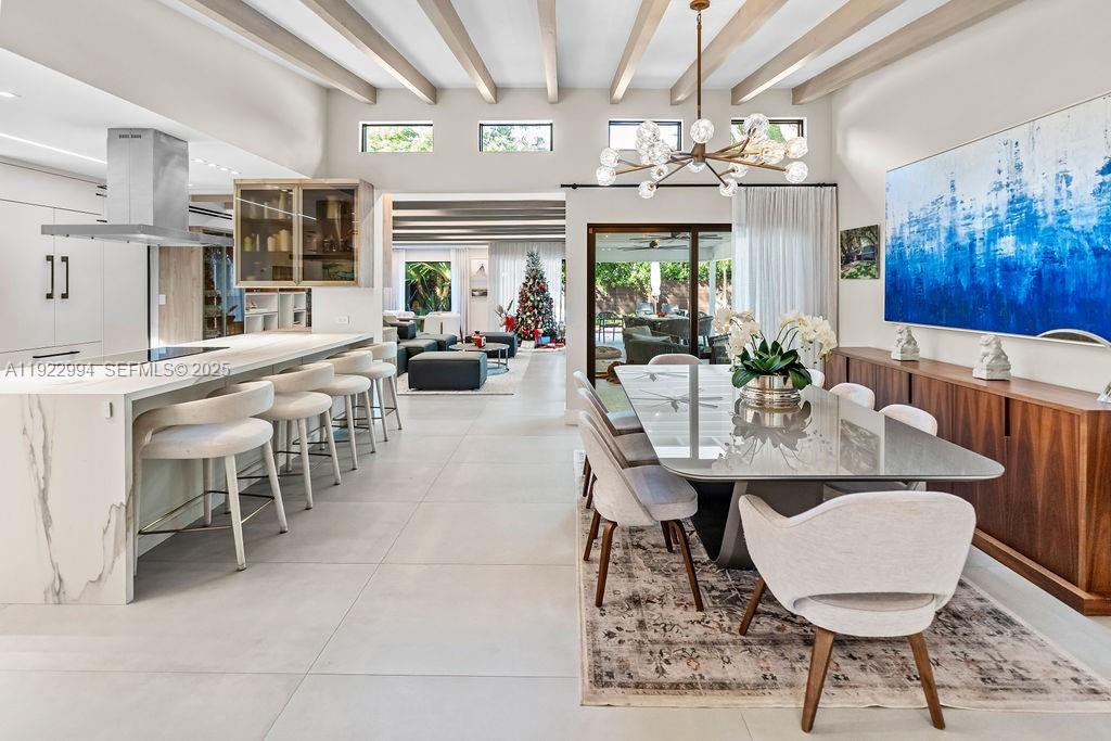 4095 Battersea Road Miami, FL 33133 - Photo 10 of 82 a view of a dining room with furniture window and outside view