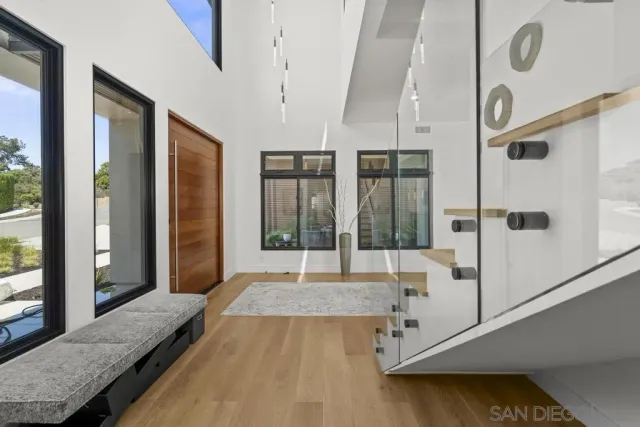 a spacious bedroom with a large bed and a large window