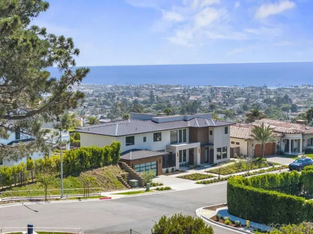 a view of a house with a swimming pool and a yard