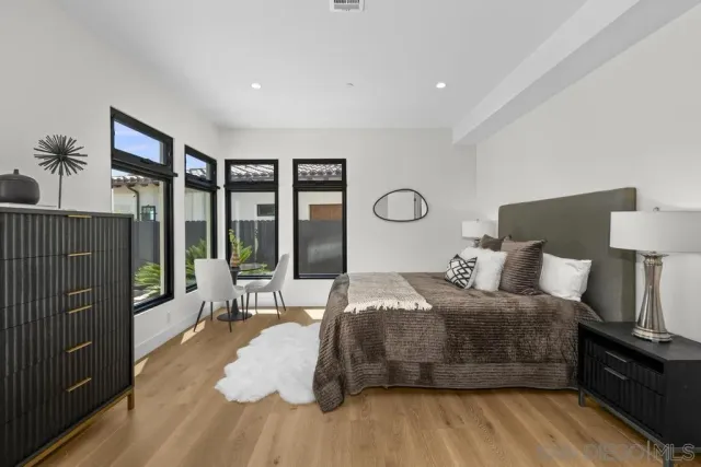 a kitchen with a sink and a mirror