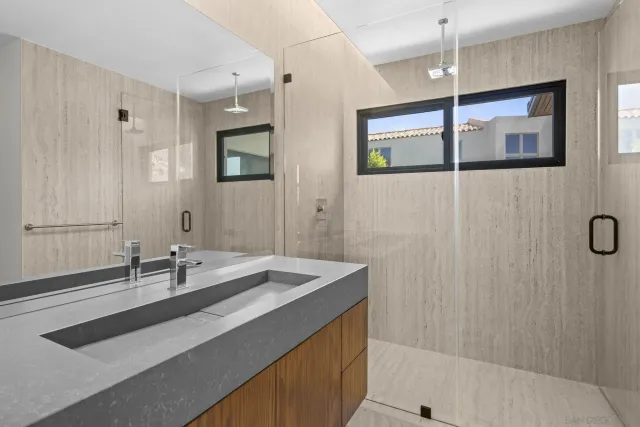 an aerial view of residential houses with outdoor space and river