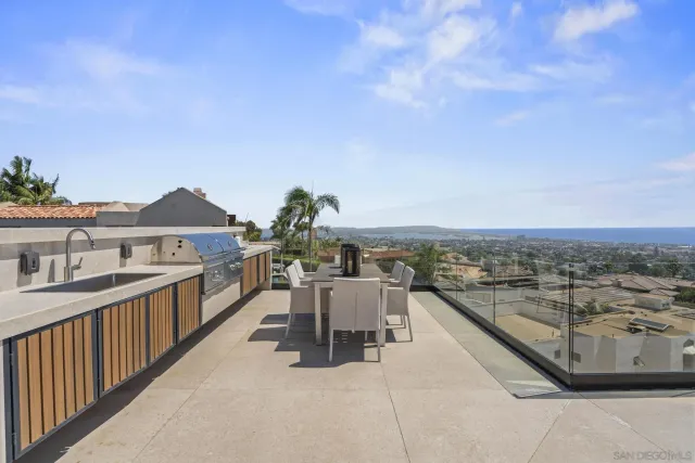 a view of a terrace with furniture and stove