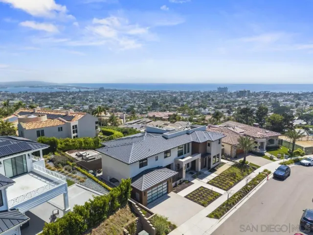 a balcony with outdoor seating and city view