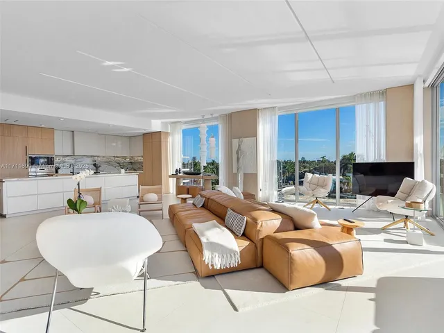 a living room with fireplace furniture and a wooden floor