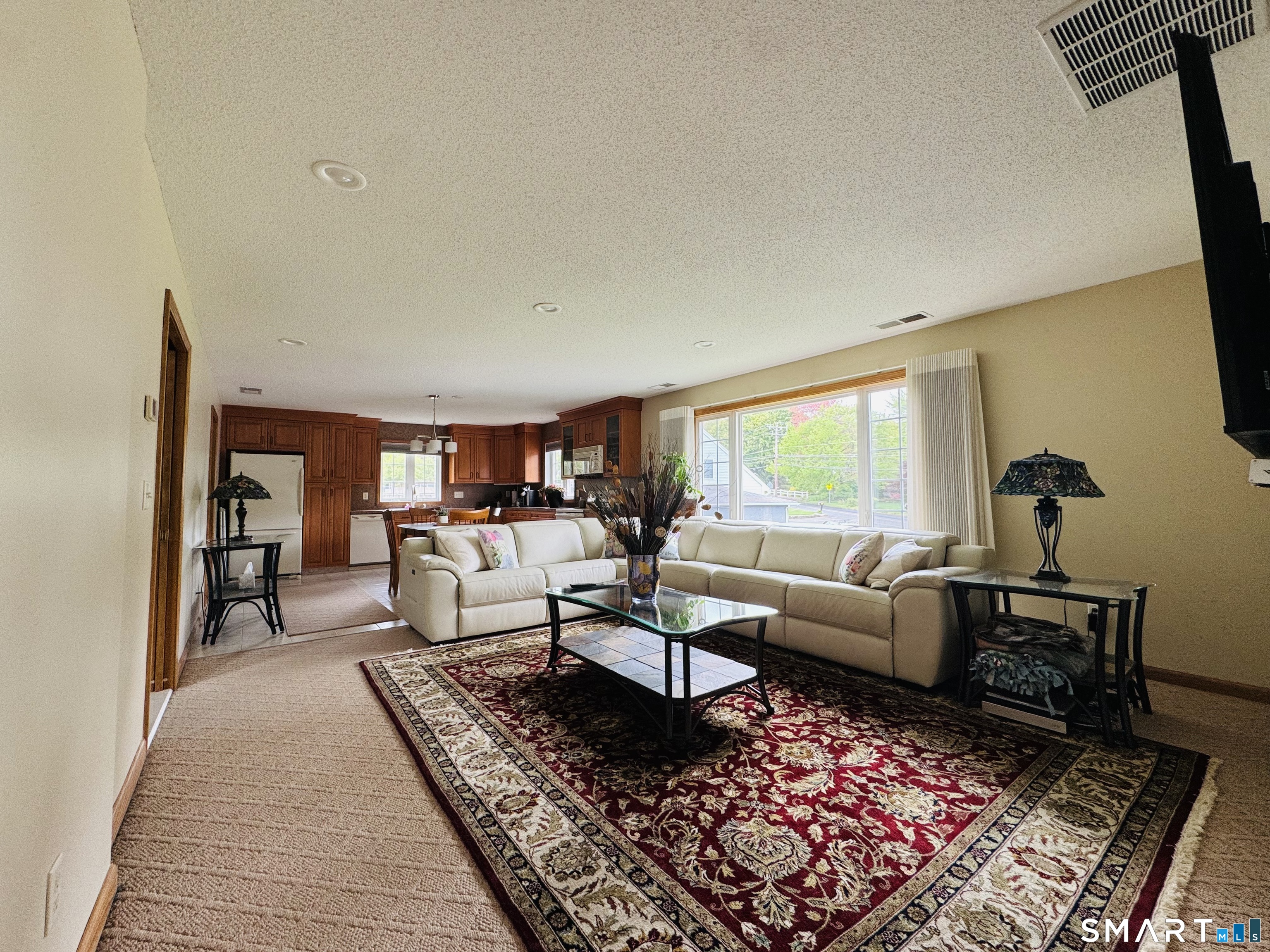 1514 Woodtick Road Wolcott, CT 06716 - Photo 20 of 23 a living room with furniture and a rug