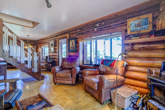 a view of living room with furniture and window