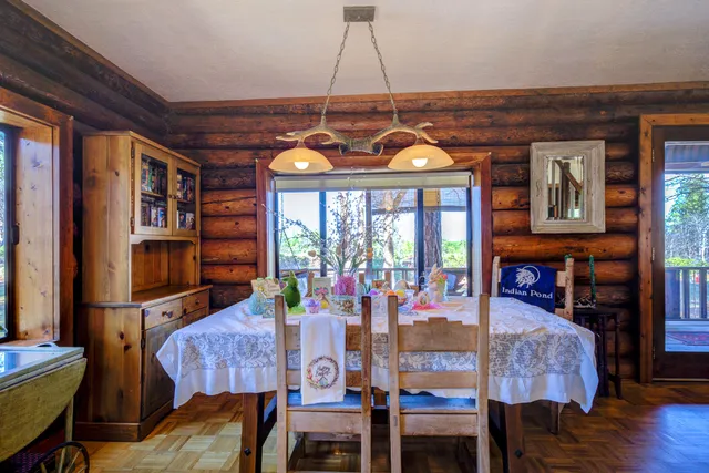 a kitchen with wooden cabinets and a stove top oven